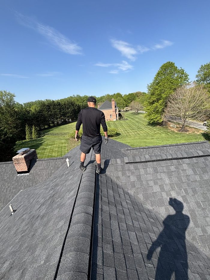 Becker Alrub inspecting a completed roof in Baltimore County